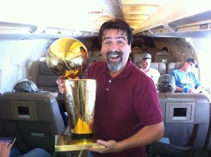 Victor Villalba with the Larry O’ Brien NBA Championship trophy presented to the 2011 NBA champion Dallas Mavericks